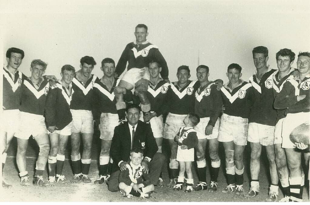 Don Adams (on shoulders of Gloucester players) was winger in the Australian team in 1956. He is due to speak at next week's Men of League lunch.