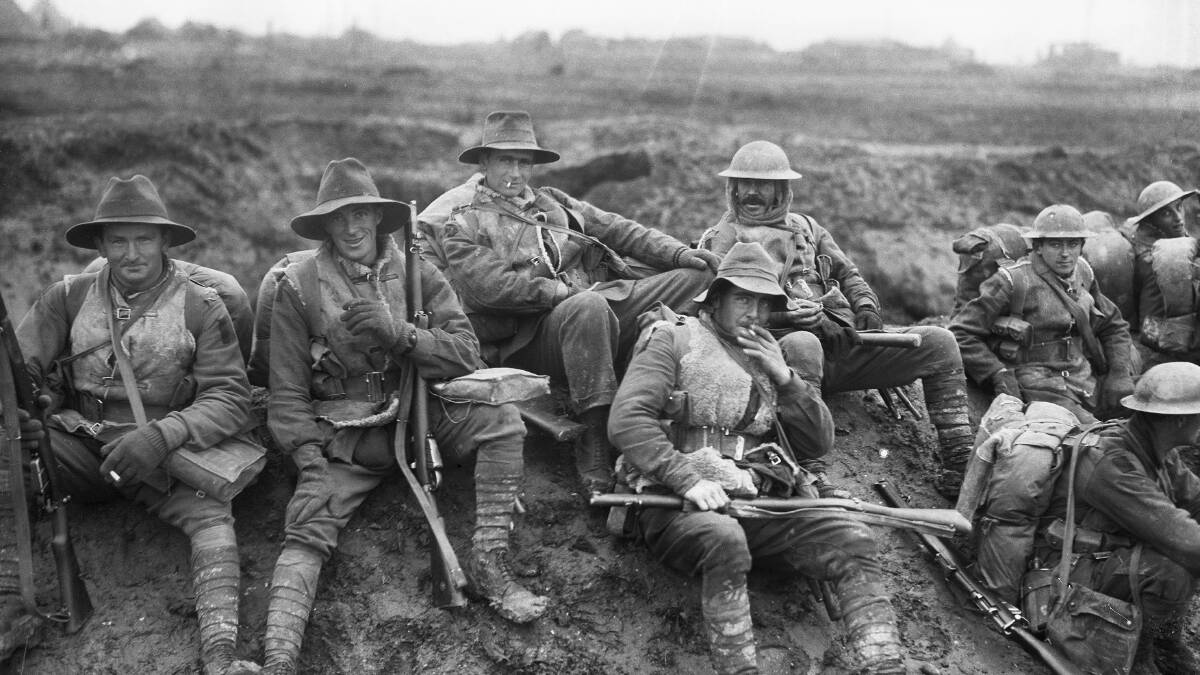 ON THE MARCH: Soldiers of the 5th Australian Division in December 1916 resting by the side of the Montauban road, near Mametz. PHOTO: AWM E00019  