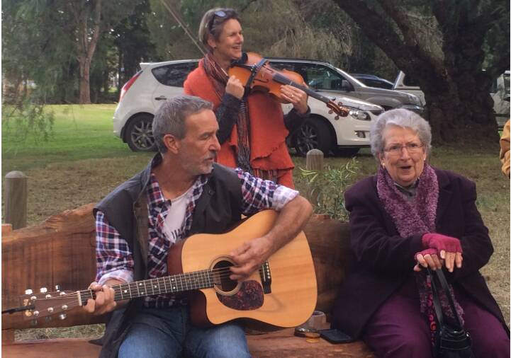 Guy's brother Brian, mother Pat Mills and Carol Ahern performed a song.