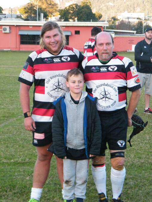 Retirement: Dennis Wamsley (right) notched up 400 games for the Cockies during the 2017 season pictured with his sons, Kenneth (left) and Liam (in front).