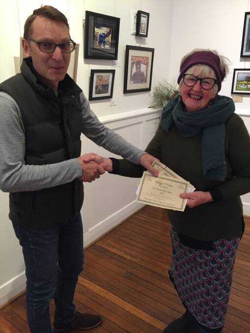 Ronnie accepts his prize from Gloucester Gallery committee member Adele Compton. 