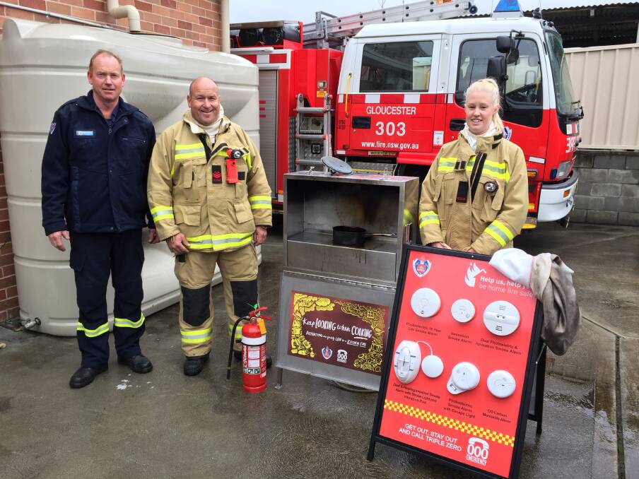 Message: Captain Mark Edwards, deputy captain David Cox and firefighter Rhea Holstein encouraged Gloucester residents to be wary of kitchen fires. Photo: Rob Douglas.