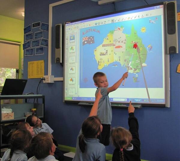 Hayden Henley using one of Stratford Public School's interactive whiteboards.