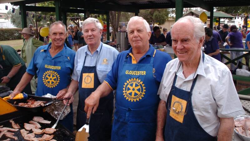 Gloucester Rotary Club members John Faull, Bruce Montgomerie, Bill Radford and Don McLeod hard at work at the barbecue. 