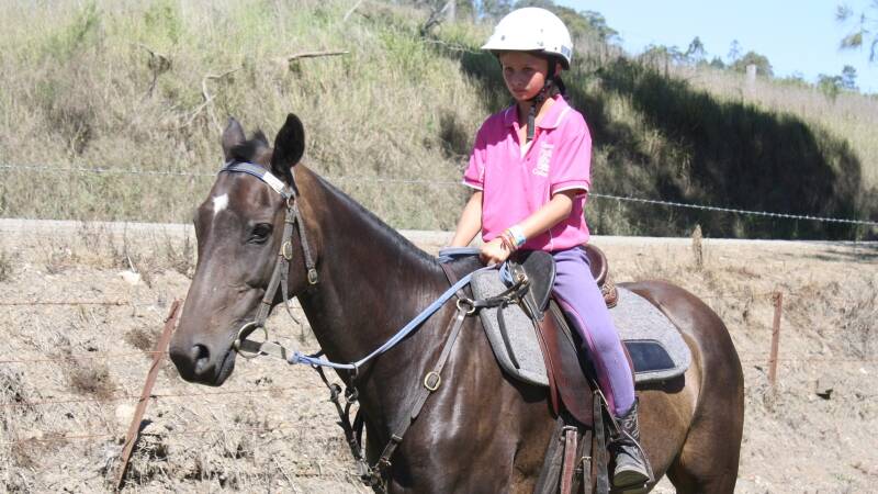 Grace Rutledge keeps her horse under tight control.