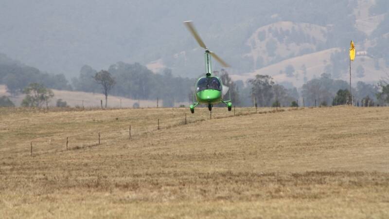 A gyrocopter takes off from Gloucester airstrip.