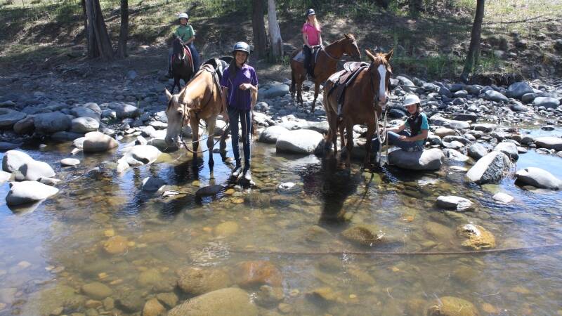 Shelby Dunn, Sharni Worth, Natalie Lorougetel and Chloe Shultz enjoy the beautiful Cobark River with their mounts during last week’s camp.