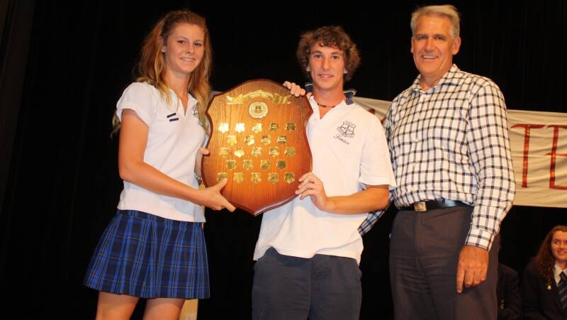 Ayla Ansell and Nathan Butler from Belbora House with the House Shield and presenter Ray Martin.