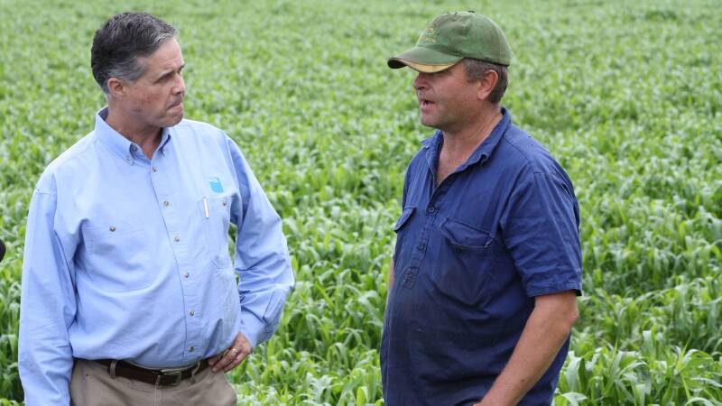AGL’s head of Upstream Gas Mike Moraza with farmer Mark Harris on the company’s Tiedmans property.