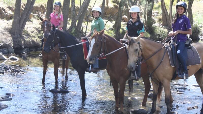 Shelby Dunn, Sharni Worth, Natalie Lorougetel and Chloe Shultz enjoy the beautiful Cobark River with their mounts during last week’s camp.
