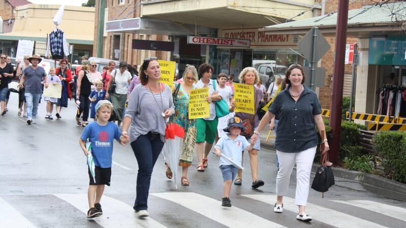 Parents rally against changes at their children's schools.