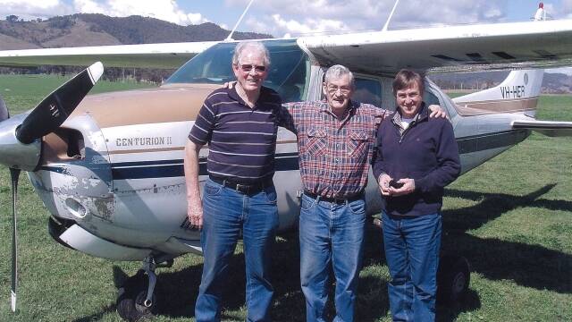 Pilot Nick McGlone with Don Readford and Gary Donovan at Gloucester airstrip. The Cessna 210 in the background is similar to the one that disappeared in the Barrington Tops in 1981.