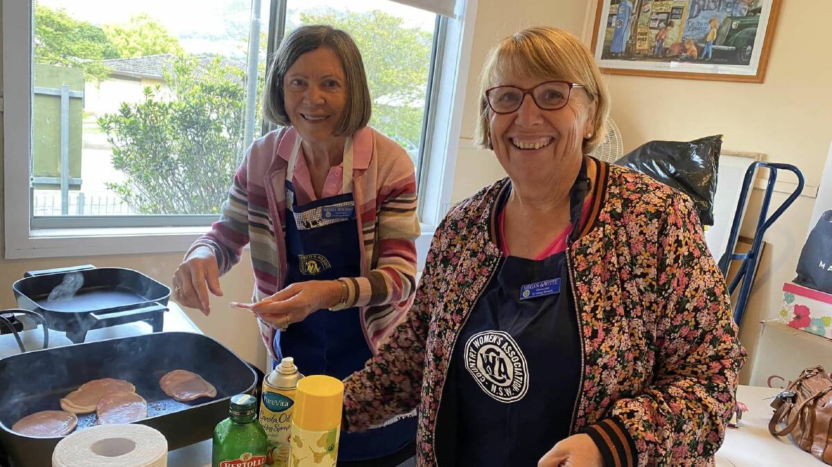 Rhonda Merchant and Megan de Witte from the CWA Evening Branch handling cooking duties at last year's fundraiser. Picture supplied.