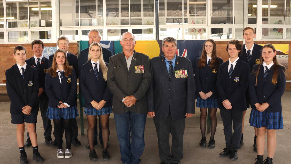 Gloucester RSL Sub-branch members, Greg Godde and John Salter with Gloucester High School students and vice principal, Mik Wisely. Picture by Rick Kernick.
