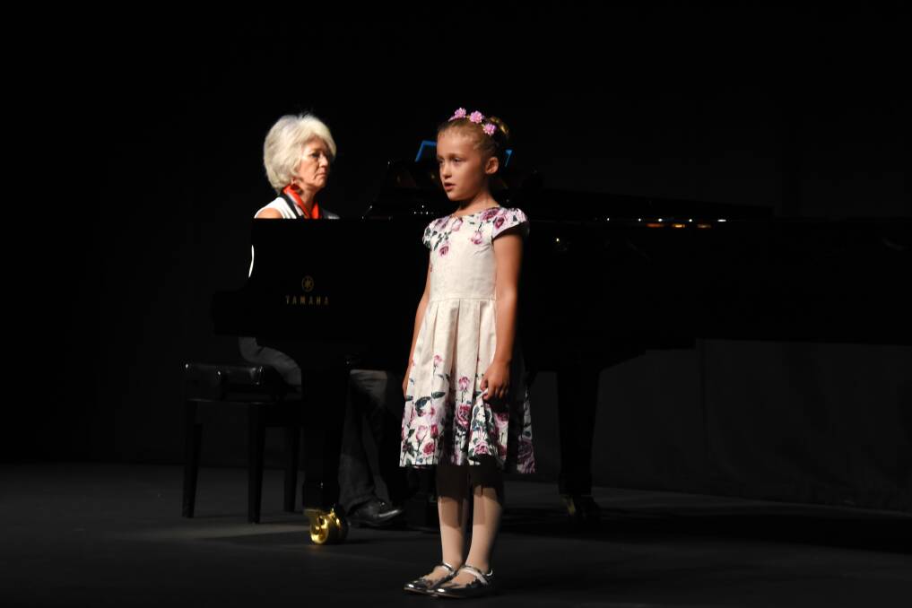 Eight years and under: Miley Polson from Taree, accompanied by Deirdre Sutherland.