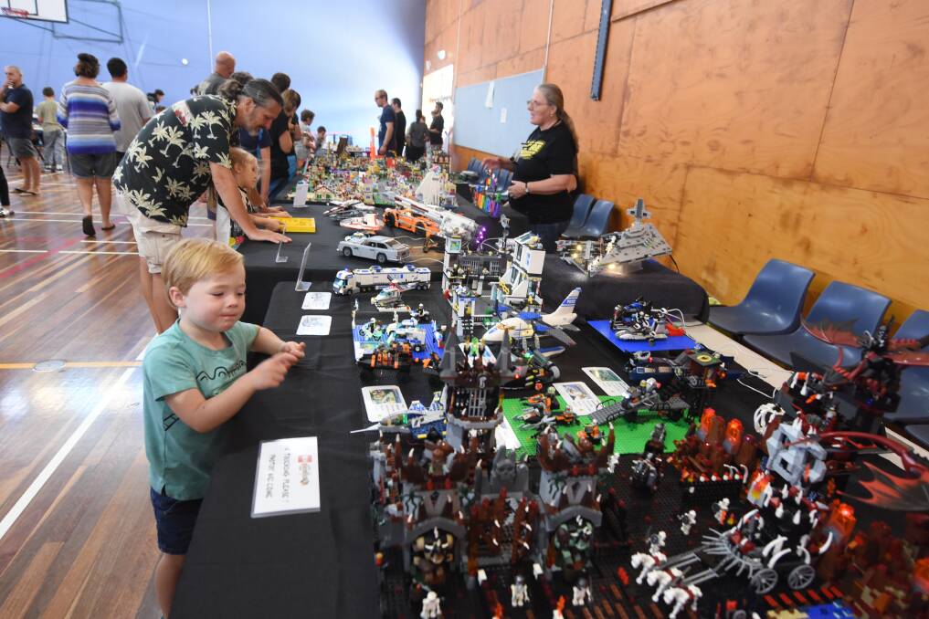 Amazing displays: Lachlan Reid takes a close look at creations on display last year. Photo: Scott Calvin.