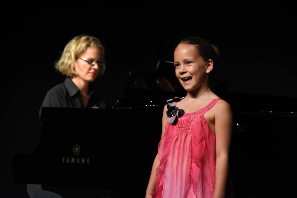 Eight years and under: Moya Wills from Port Macquarie, accompanied by pianist Lydia Wills.