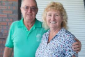 Sponsor Steve Kriss congratulates veterans golf winner Anne Wand.