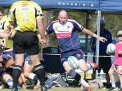 Ricky Campbell from the Ratz puts boot to ball during the 2020 grand final against Wallamba. The Ratz won the game.