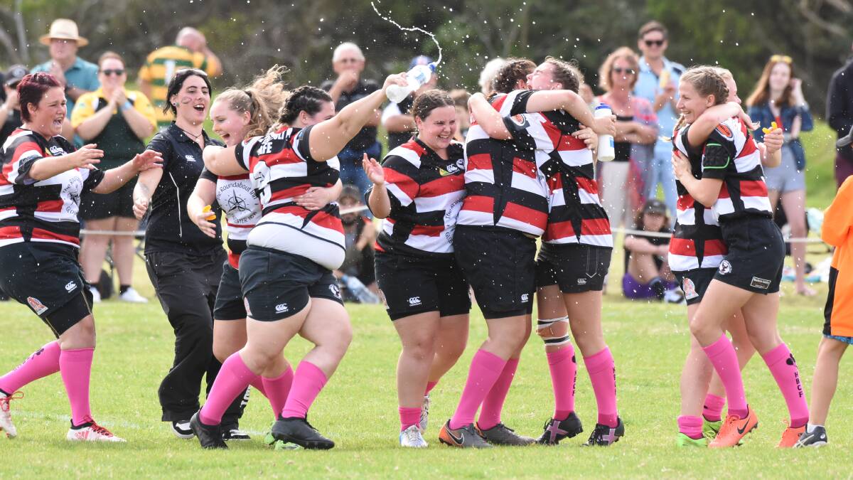 We are the champions: Gloucester players celebrate winning the Lower North Coast women's sevens grand final at Tuncurry. Photo Scott Calvin.