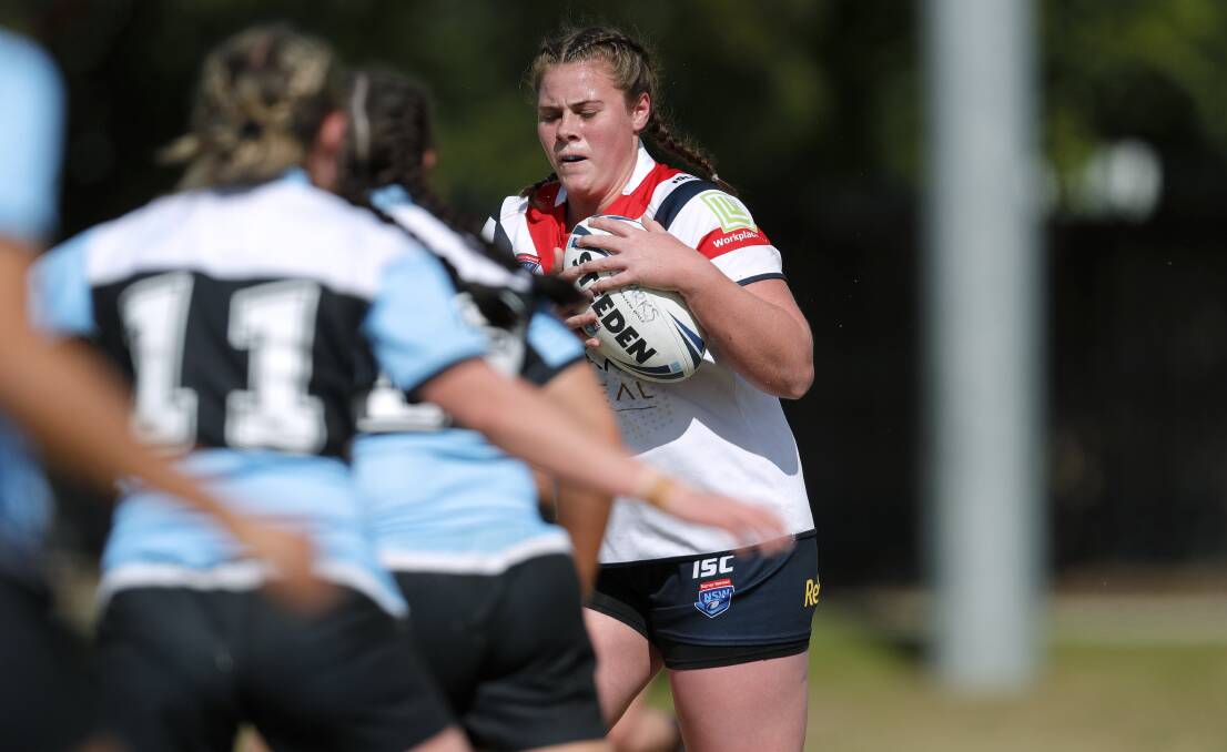 Tayla Predebon carries the ball forward for the Central Coast Roosters. She'll play with the Newcastle Knights in NRLW 2022.