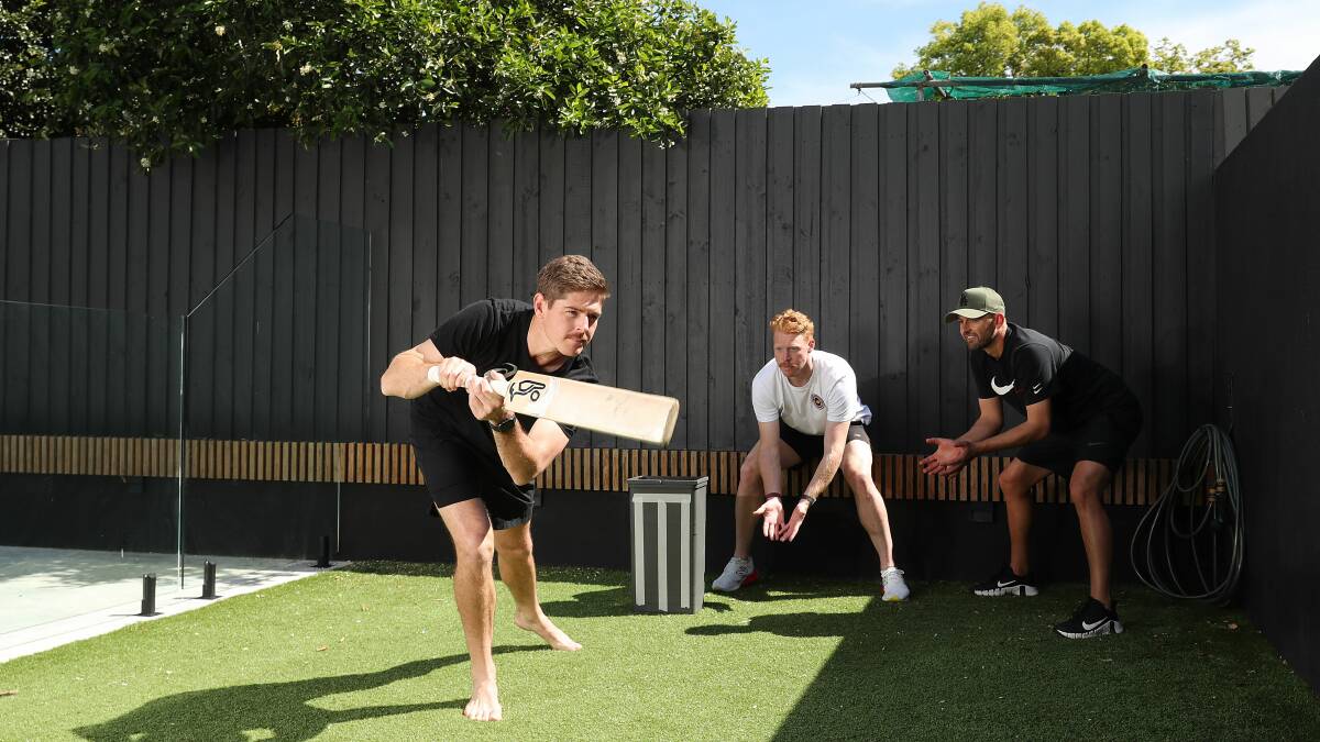 Howzat? NSW cricketers Daniel Hughes, Liam Hatcher and Nathan Lyon playing a game of backyard cricket. Photo Getty Images