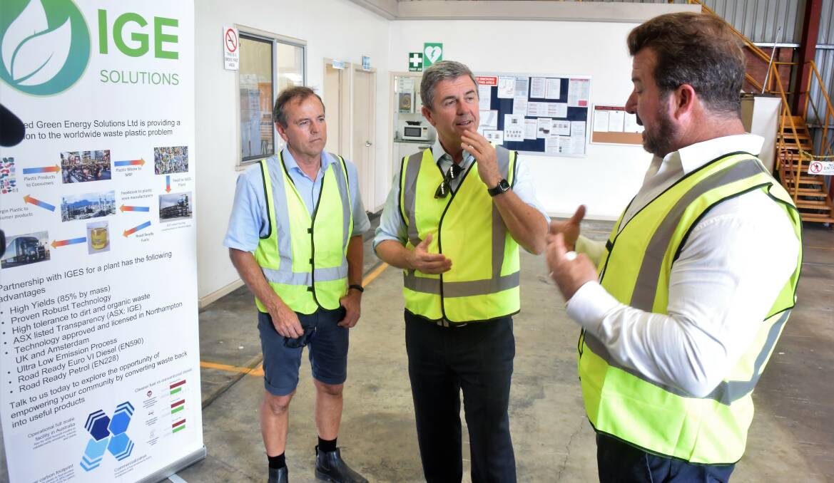 Member for Lyne Dr David Gillespie (centre), Jim Pearson and IGE Solutions chairman Paul Dickson at the Jim Pearson Transport depot in Taree recently, discussing the truck company's potential use of recycled diesel.