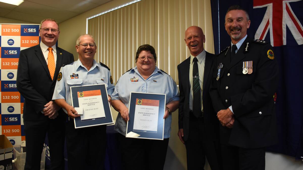 Graeme and Wendy Ruff of the Taree City SES were awarded life membership for their long service. They are being congratulated by member for Myall Lakes Stephen Bromhead, MidCoast Council mayor David West and NSW SES Mid North Coast Region Controller, Anthony Day.