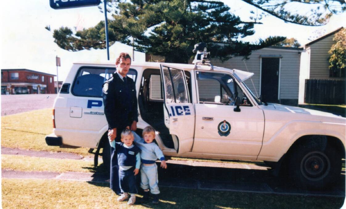 A young general duties officer, Trevor Carrol outside the Forster Police Station with twin sons, Marc and Luke in 1985.