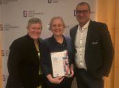 Senior land use planners, Sue Calvin and Alexandra Macvean with general manager, Adrian Panuccio accepting the award.