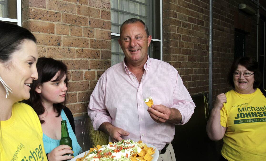 Michael Johnsen (pink shirt), hanging out with campaign staff at the back of his offices in Maitland in 2013. Picture: Max Mason-Hubers