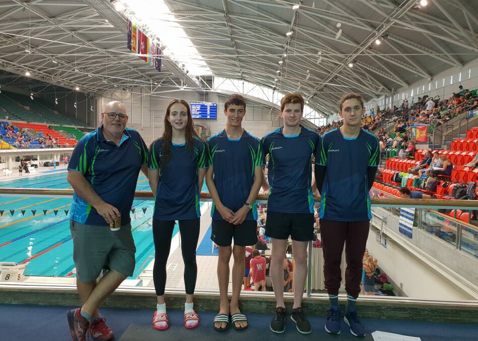 Coach Michael Abel with Stroud Seals swimmers, Grace Gray, Robert Stanley, Tim Tatchell and Raff Francisci. Photo supplied