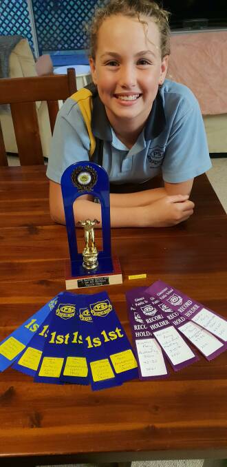 Kaitlin Perry is very proud of her record-breaking achievements at the Gloucester Public School swimming carnival. Photo Tamara Perry