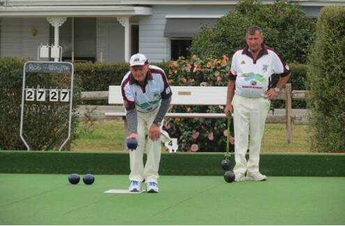 Tight match: Rob Henininger and Wayne Groves neck and neck in the Minor Singles semi-final at Gloucester Bowling Club. Photo: Supplied