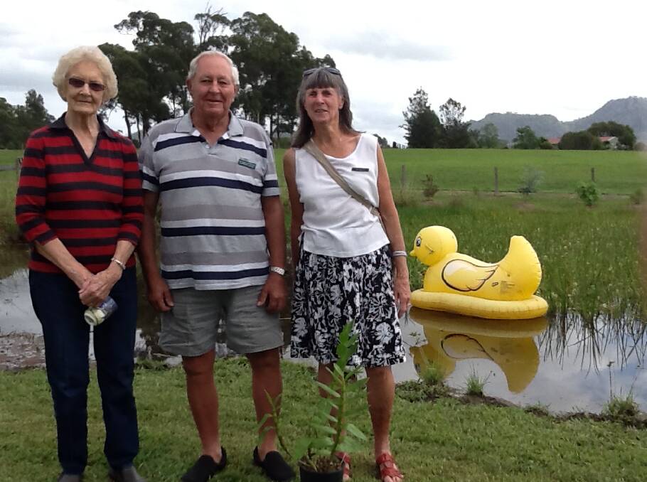 Margaret Randall, Howard Ellis and Di Relf beside the dam with the Bucketts in the background. Photo supplied