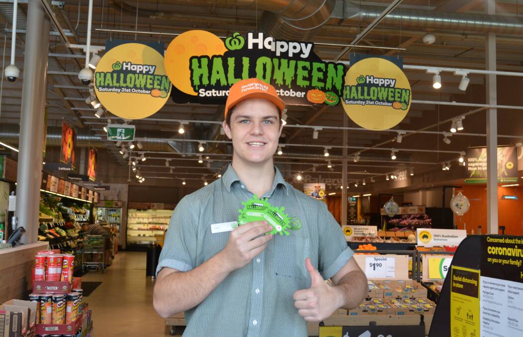 Woolworth Gloucester staff member, Jake Danton is ready to sell the $2 charity tokens to his customers. Photo Anne Keen 