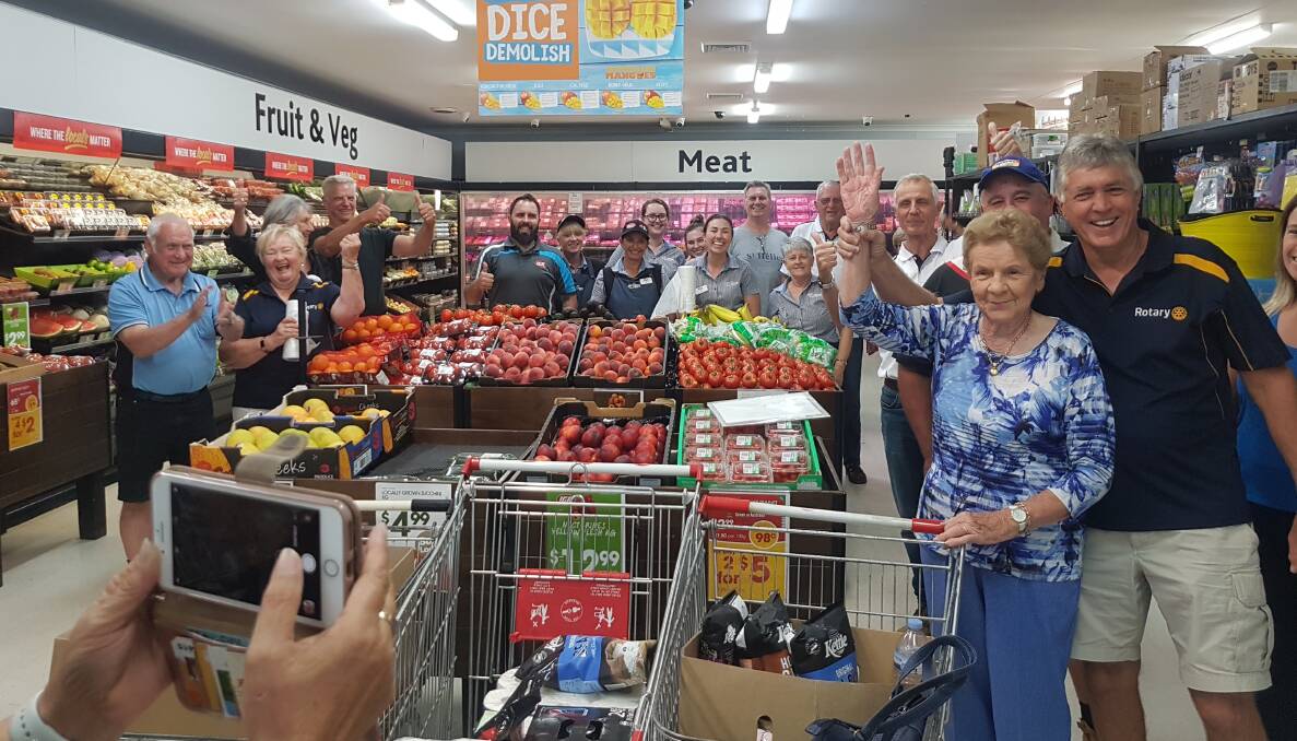 Yvonne Bagnall gets a helping hand to collect her grocery dash. Photo supplied