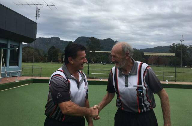 Mark Groves congratulates John Andrews after a well fought match for the Gloucester Bowling Club's championship title. Photo supplied