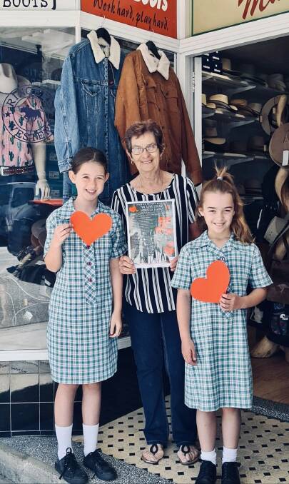St Joey's students Mia Barnes and Xanthe Fenning with Pam Coote from Macs Boots. Photo supplied