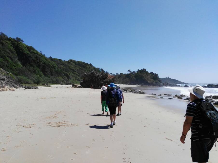 Gloucester Environment Group members take a walk on Shelly Beach. Photo supplied
