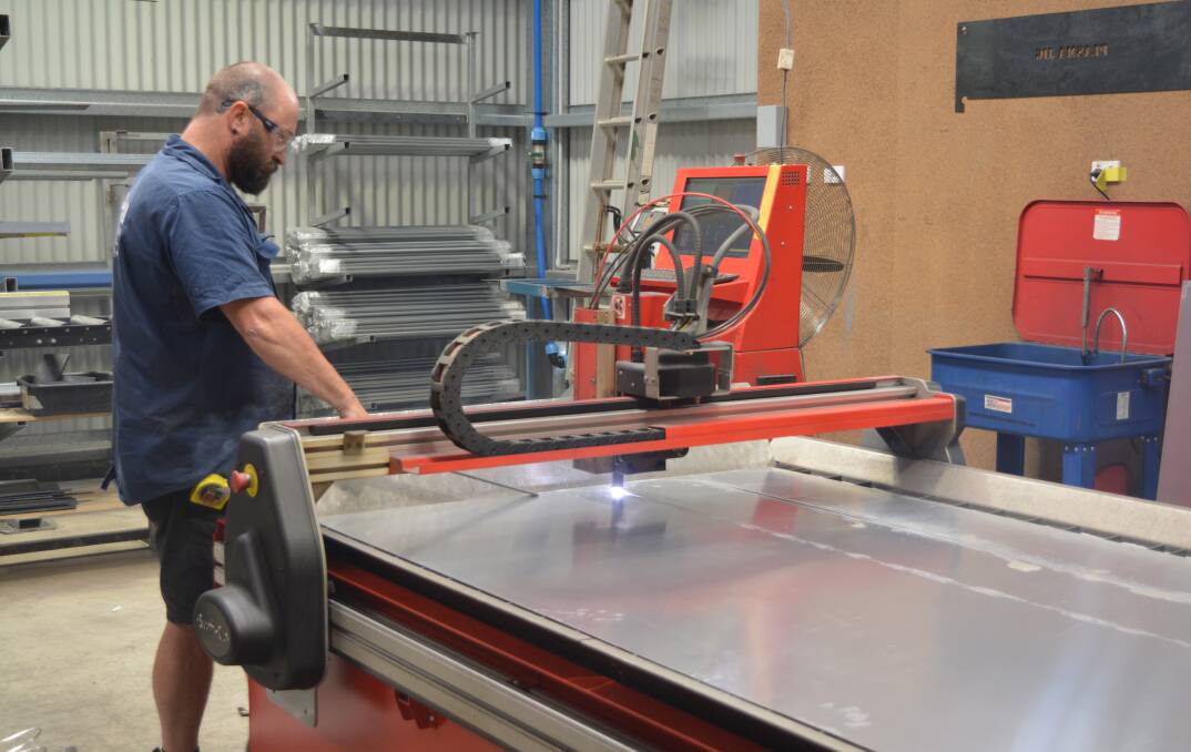 Craig Beeston is working with the plasma cutter used to cut metal. Photo Anne keen