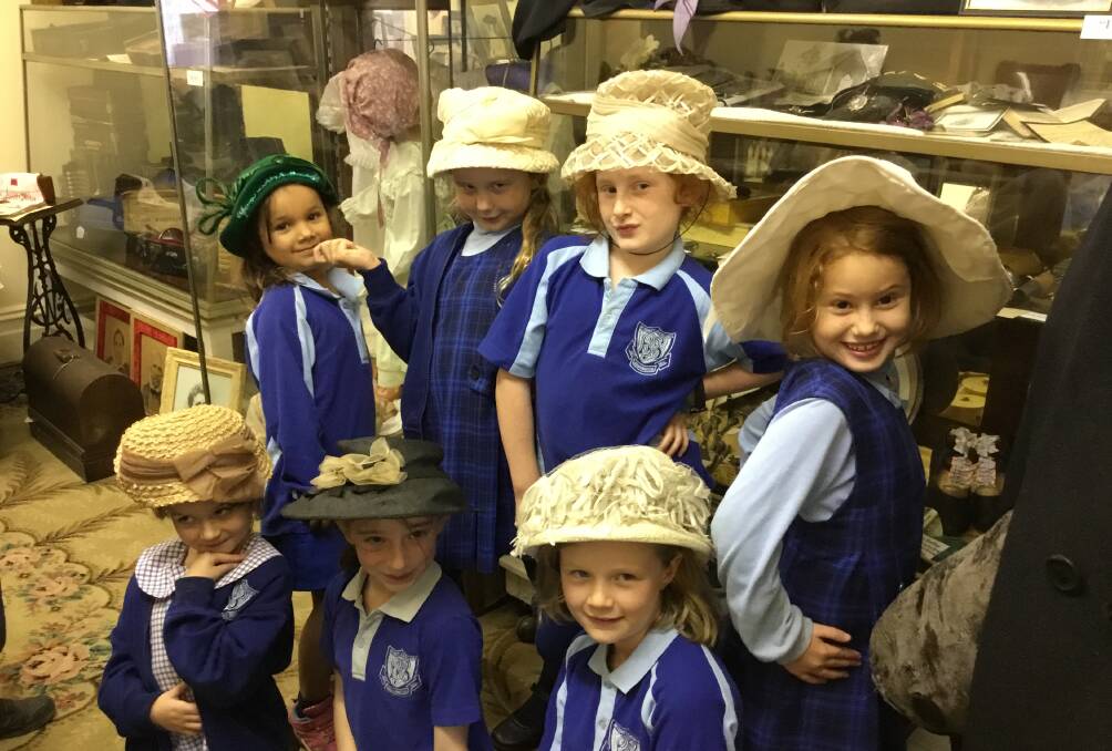 Barrington Public School students get to try on the wares of the days gone by during their visit to the Gloucester museum. Photo supplied