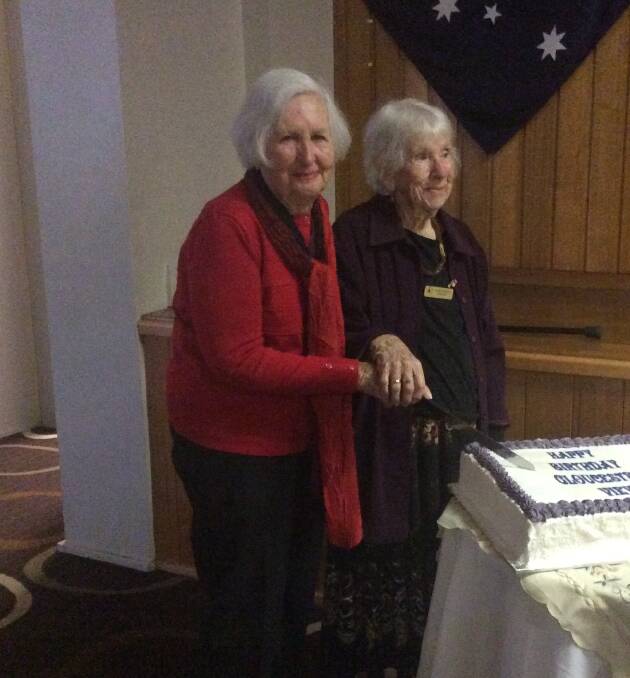 Joyce Buswell and Margaruite Barnes cutting the club's 27th birthday cake.