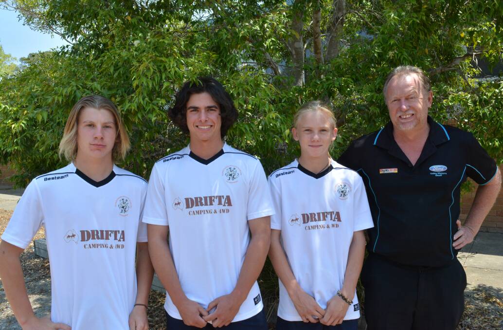 Premier league: Beau Blanch, Cody Howard and Kayden Schumann with their Drifta team soccer coach, Geoff Hawkins. Photo: Anne Keen