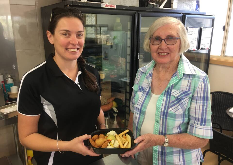Kylie Galvin and Christine Bolton get ready to send out the first of the hot, fresh dishes for Gloucester's Meals on Wheels. Photo supplied
