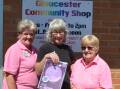 A very excited Michelle Leayr (middle) with shop volunteers Kim Arney and Fay Fenning.