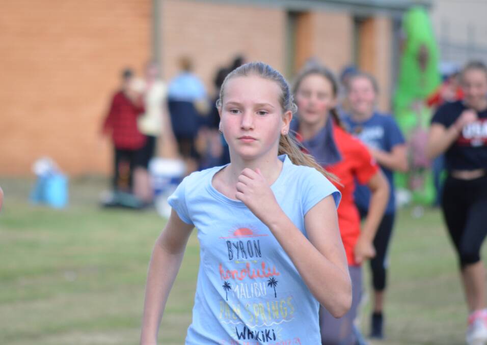12 years female champion Kaitlyn Commons running the 1500 metre race. 