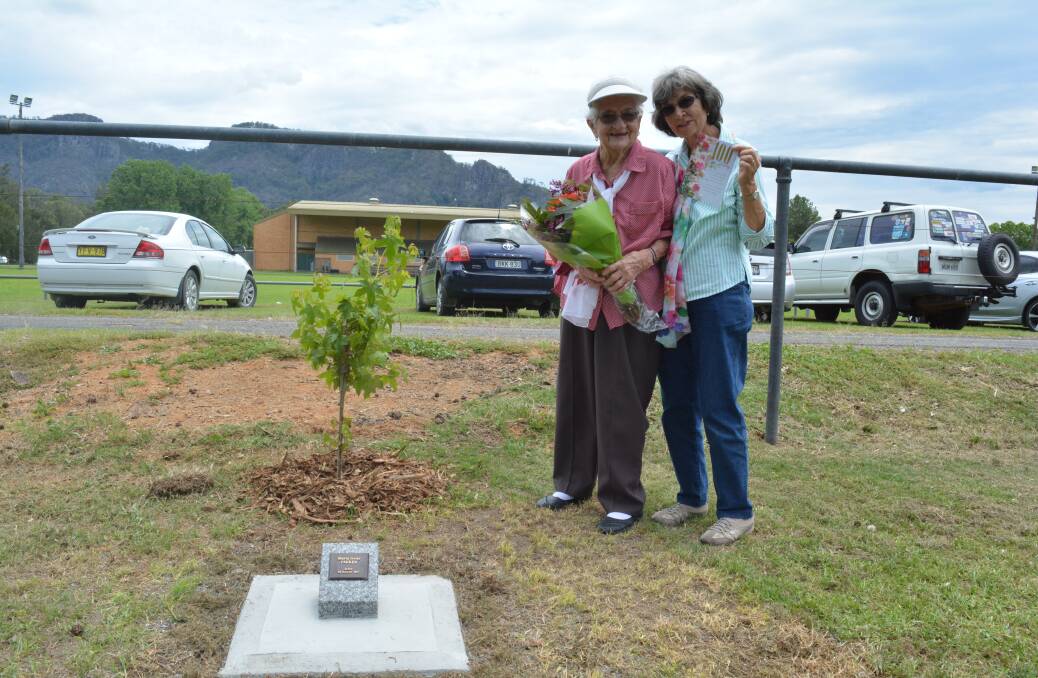 A special place: Mavis Parker and her daughter, Christine Pearson beside the tree and new plaque. Photo: Anne Keen