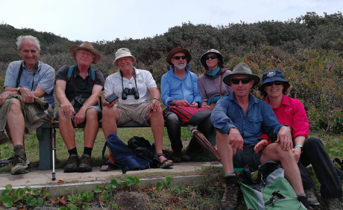 Members of the Gloucester Environment Group enjoy a rest on Connors Track during their weekend adventure camping in Hat Head National Park. Photo supplied