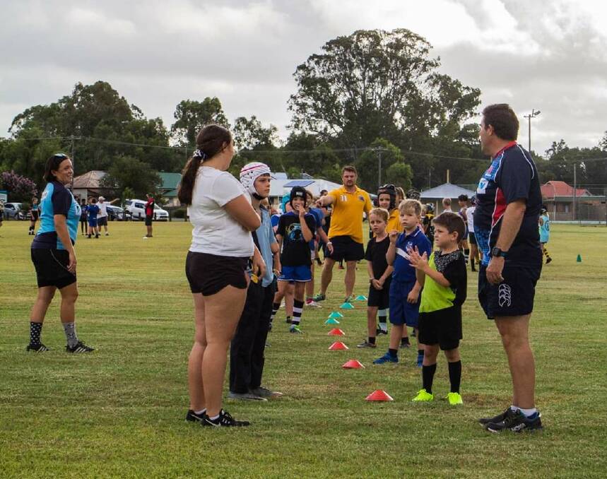 Lee Sullivan running drills with the under 10s and under 8s during the session on Friday in Nabiac. Photo Lindsay Woolnogh